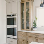 kitchen with painted island and stained perimeter.