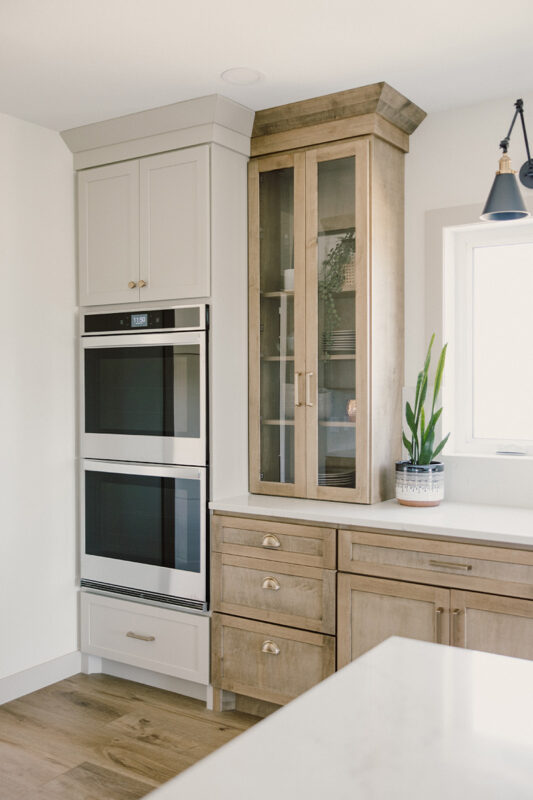 kitchen with painted island and stained perimeter.