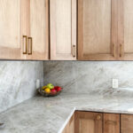 Cashew-stained kitchen perimeter cabinets.