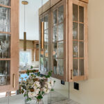 Cashew-stained kitchen perimeter cabinets.