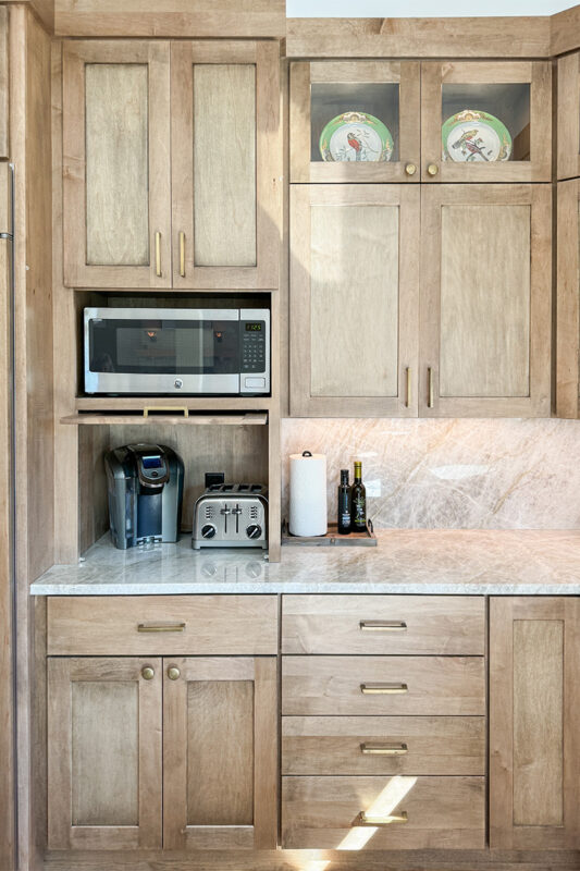 Cashew-stained kitchen perimeter cabinets.
