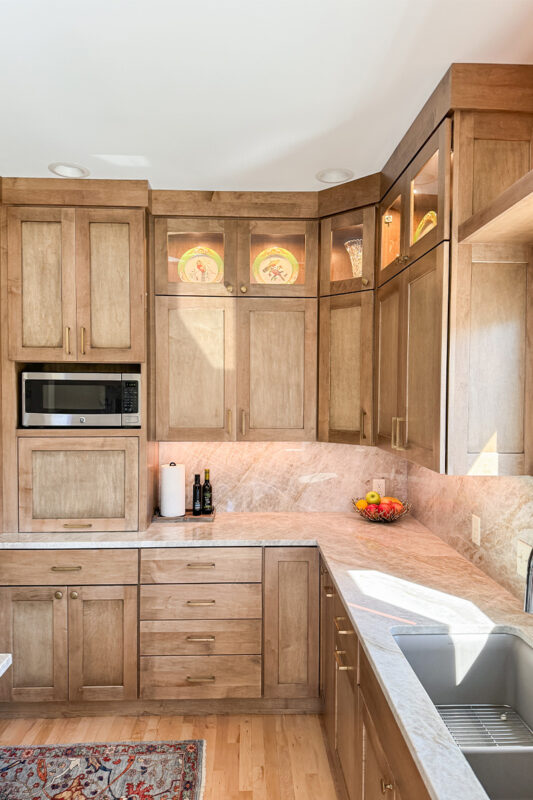 Cashew-stained kitchen perimeter cabinets.