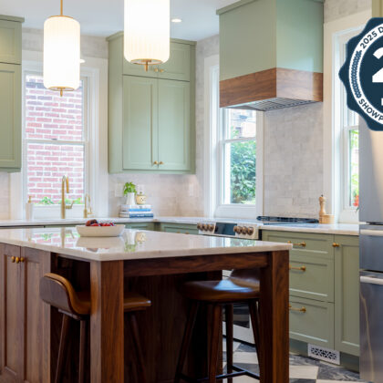 Painted kitchen perimeter cabinerts with walnut island.