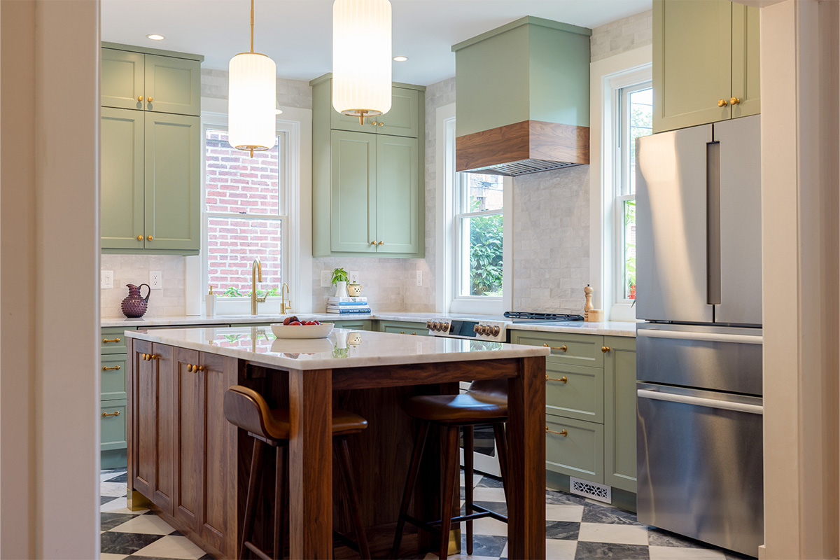 Painted kitchen perimeter cabinerts with walnut island.