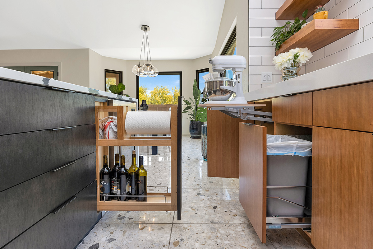 Kitchen with natural cherry perimeter cabinets and dark stained island cabinets.