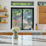 Kitchen with natural cherry perimeter cabinets.
