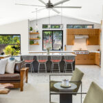 Kitchen with natural cherry perimeter cabinets and dark stained island cabinets.