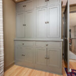 Brown painted bedroom cabinet storage.