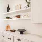 White cabinets with floating shelves