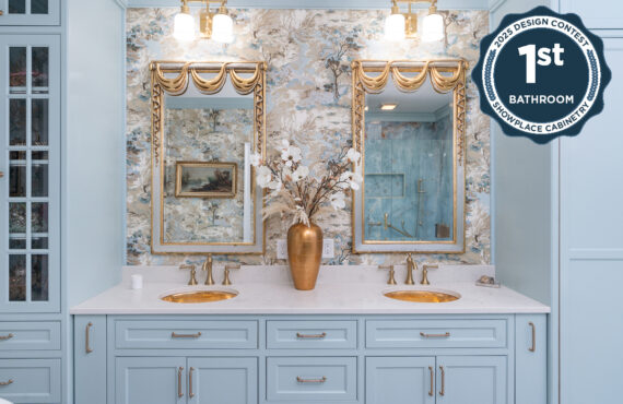 Light blue bathroom vanity cabinets with ornate gold mirrors and sink hardware.