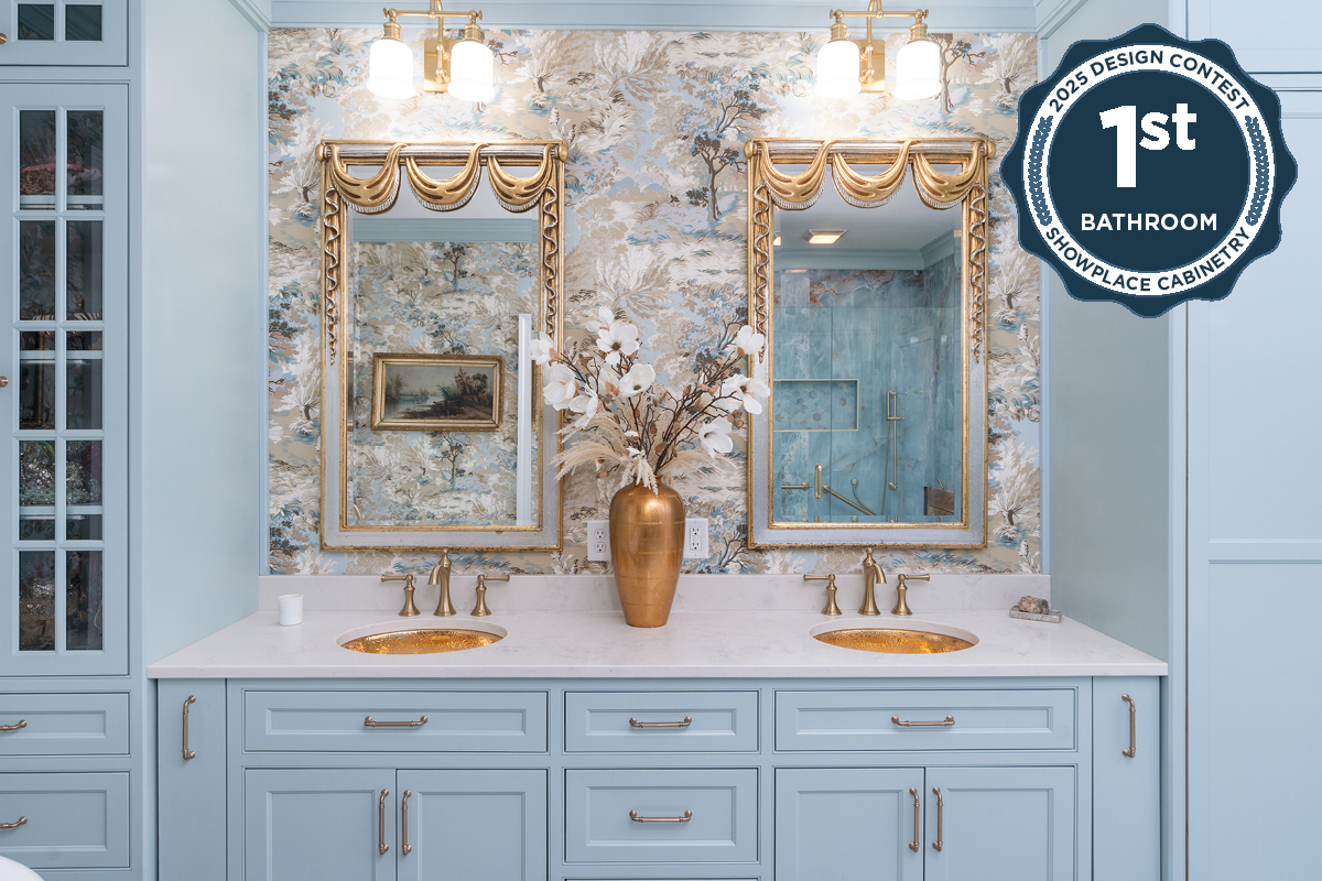 Light blue bathroom vanity cabinets with ornate gold mirrors and sink hardware.