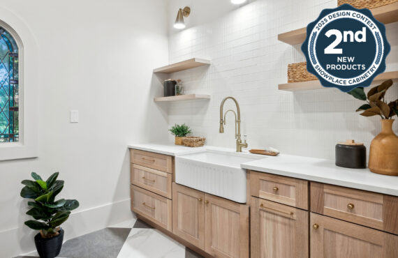 Light stained mudroom cabinets with farmer sink and floating shelves.
