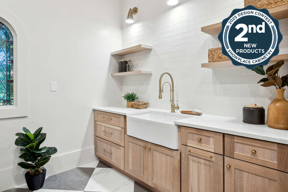 Light stained mudroom cabinets with farmer sink and floating shelves.
