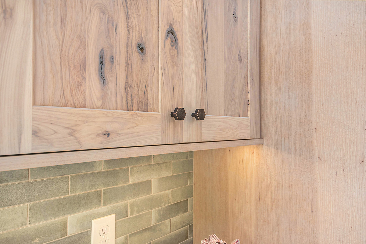 Light stain on perimeter kitchen cabinets