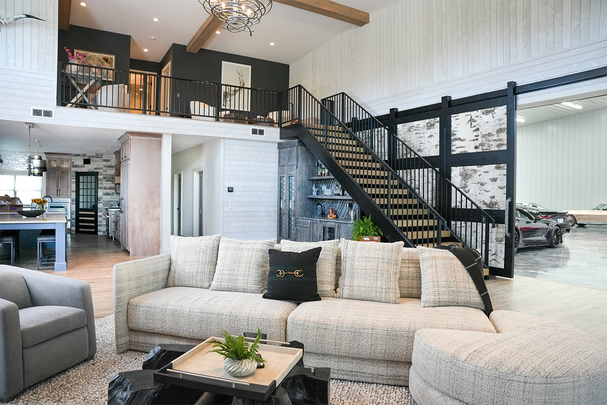 Dark stained hickory bar cabinets under a staircase