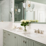 Light green painted bathroom vanity.