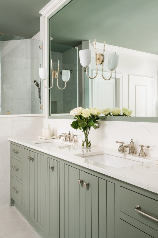 Light green painted bathroom vanity.
