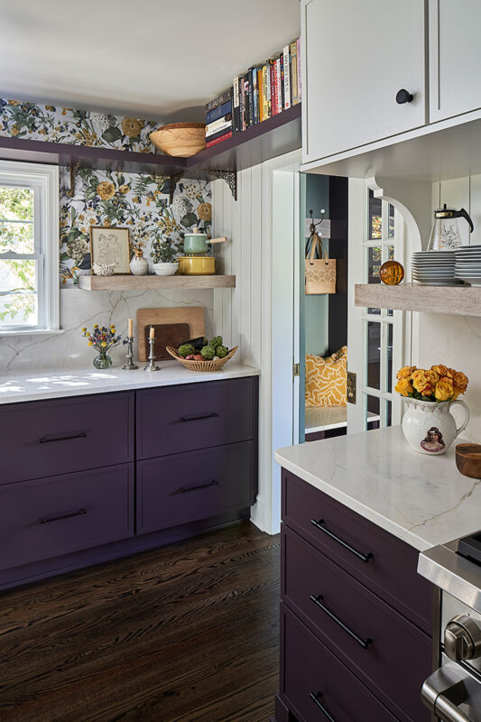 White and purple painted kitchen cabinets.