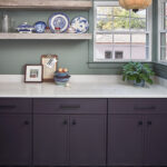White and purple painted kitchen cabinets.