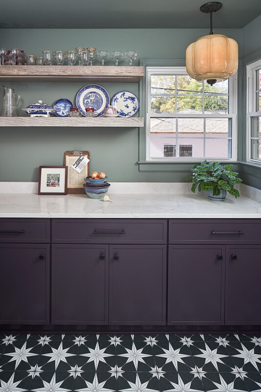 White and purple painted kitchen cabinets.