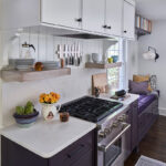 White and purple painted kitchen cabinets.