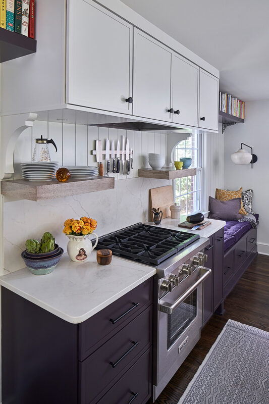 White and purple painted kitchen cabinets.