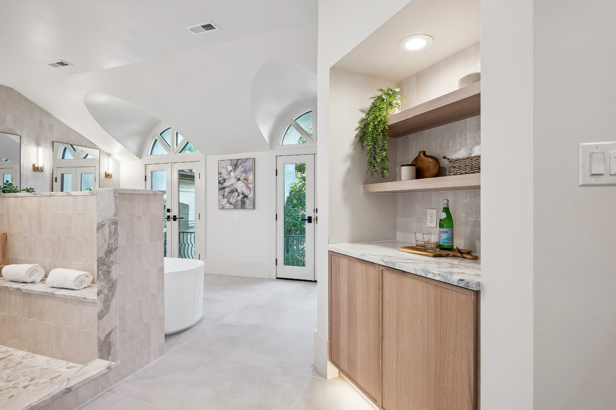 Light brown stained master bedroom cabinet with floating shelves.