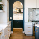Blue and white kitchen with cabinets