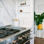 Blue and white kitchen with cabinets