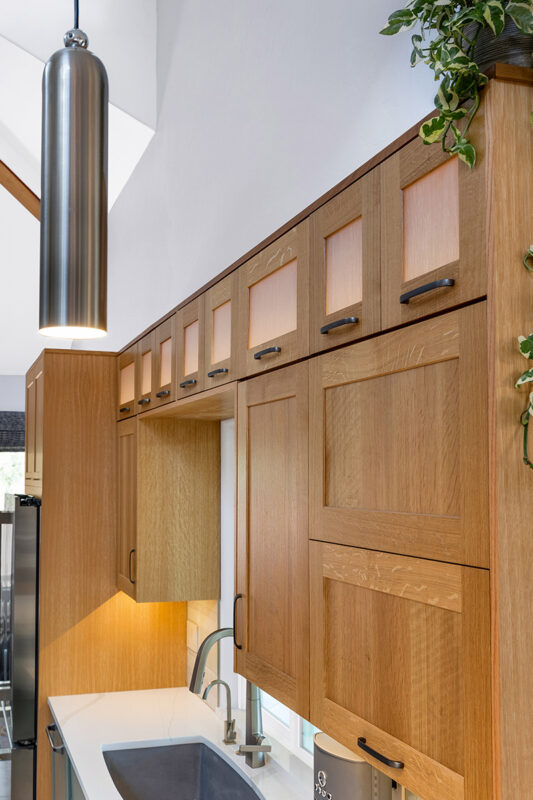 Light brown and painted gray kitchen