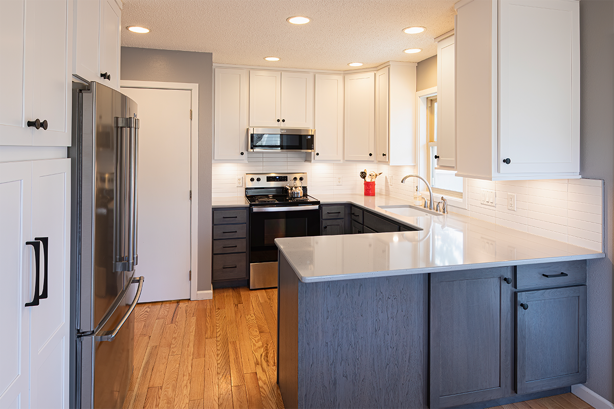 White uppers and gray stained lower kitchen cabinets