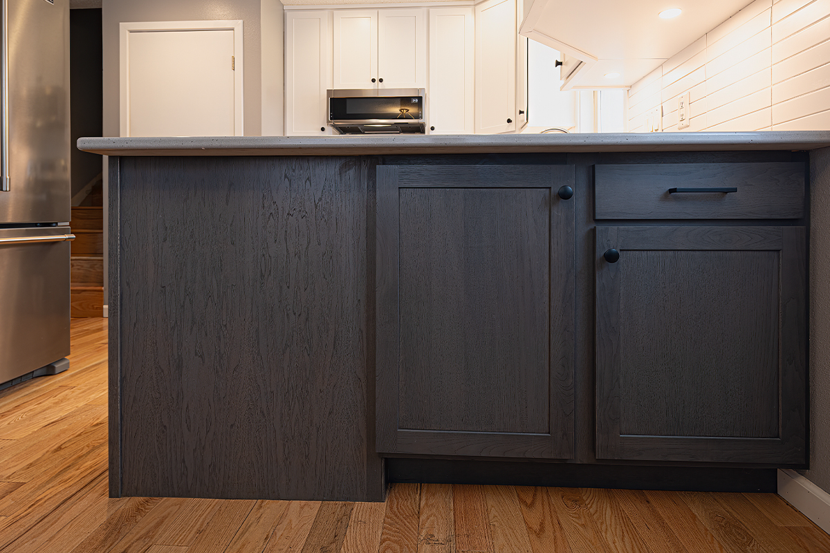White uppers and gray stained lower kitchen cabinets