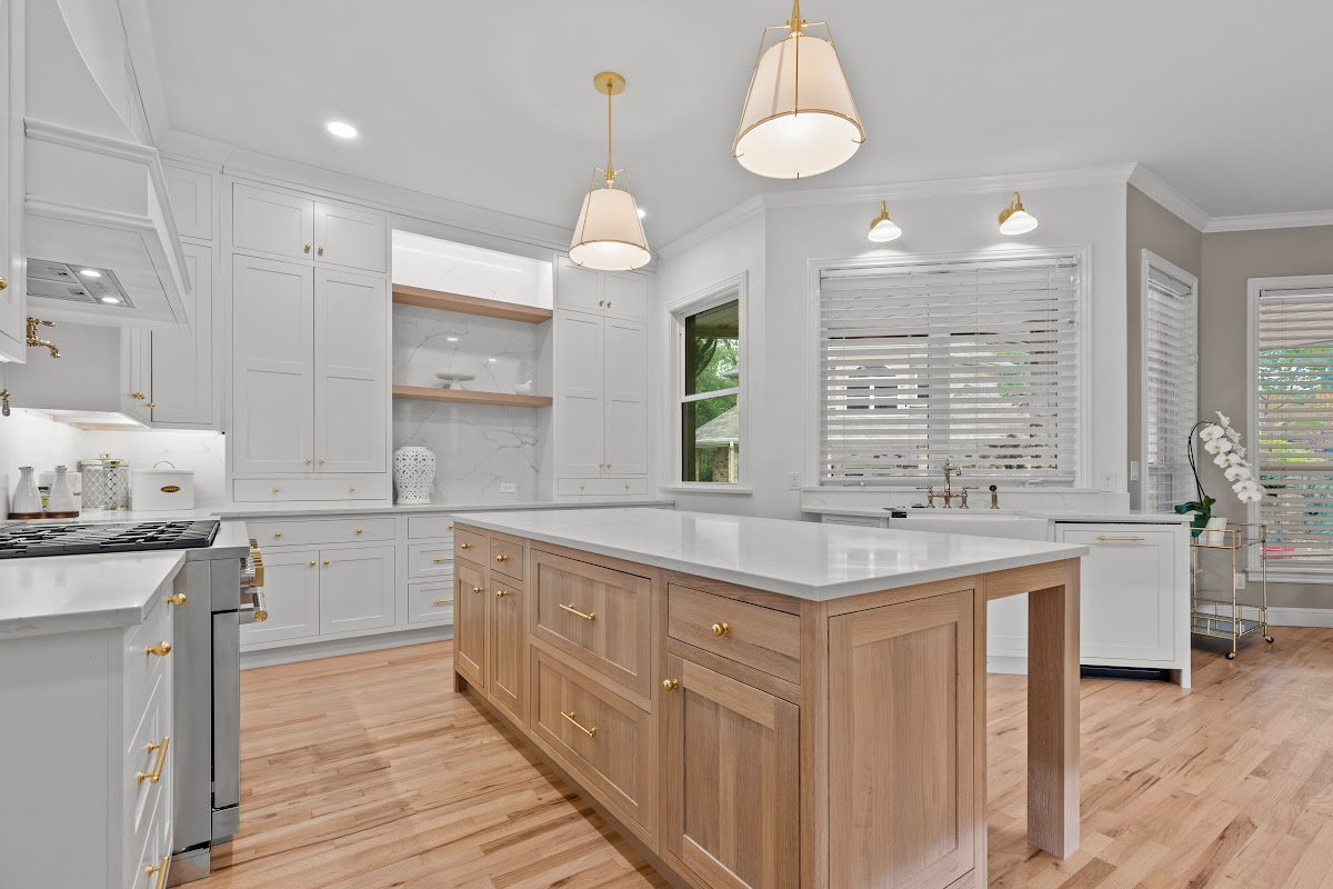 White kitchen perimeter cabinets with an island in washed out light brown Vita stain on Rift White Oak.