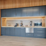 Gray painted office breakroom kitchenette.