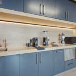 Gray painted office breakroom kitchenette.