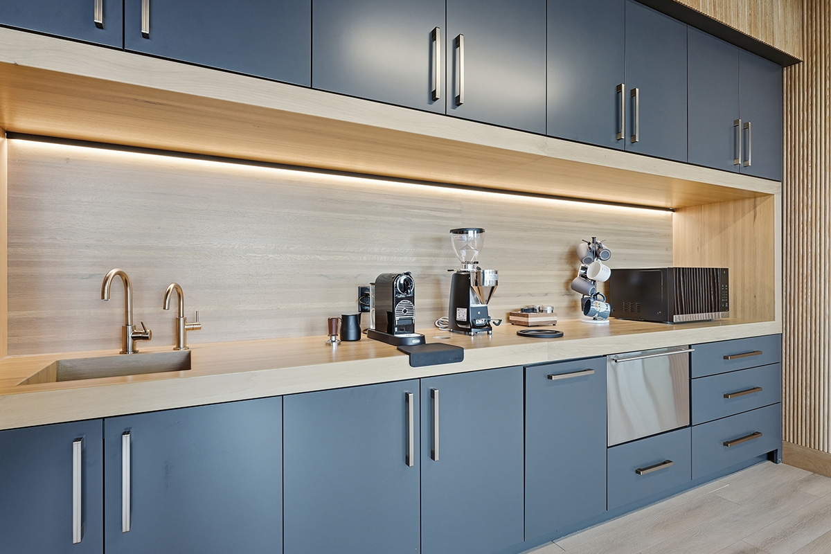 Gray painted office breakroom kitchenette.