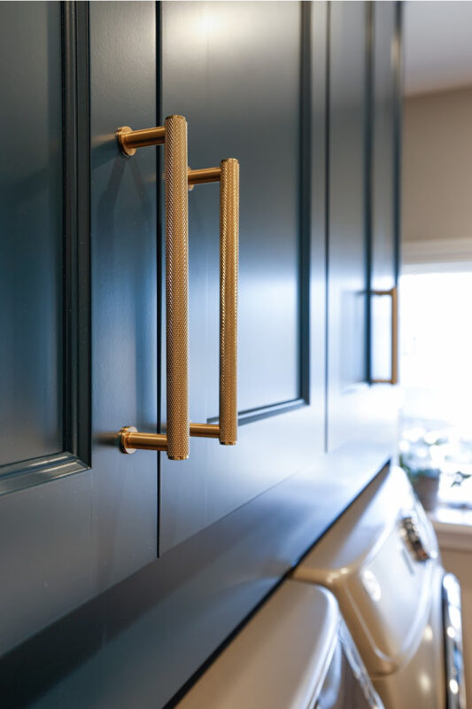 Emerald blue laundry cabinets