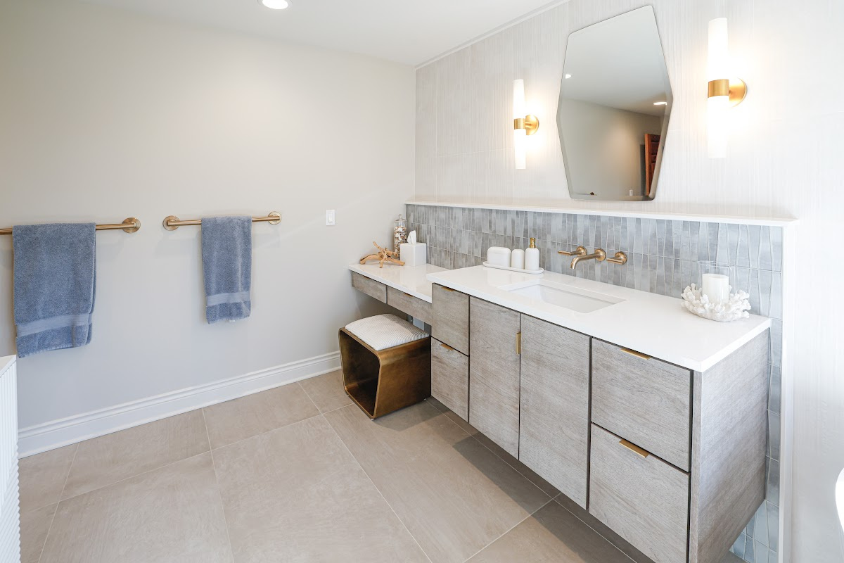 Large master bathroom with 2 vanity areas with light Montana stain, powder desk.