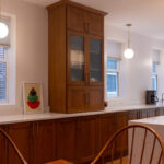 Cherry kitchen cabinets with a red Sienna stain. The layout is only one wall cabinet (intalled on countertop) installed.
