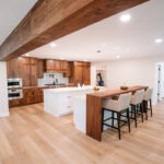 Walnut kitchen cabinets with white double islands