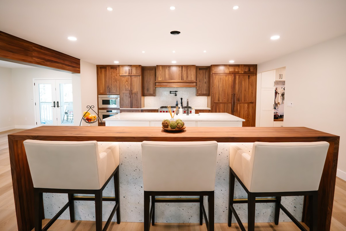 Walnut kitchen cabinets with white double islands