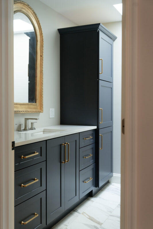 Dark Blue bathroom vanity and linen cabinets.