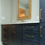Dark Blue bathroom vanity and linen cabinets.