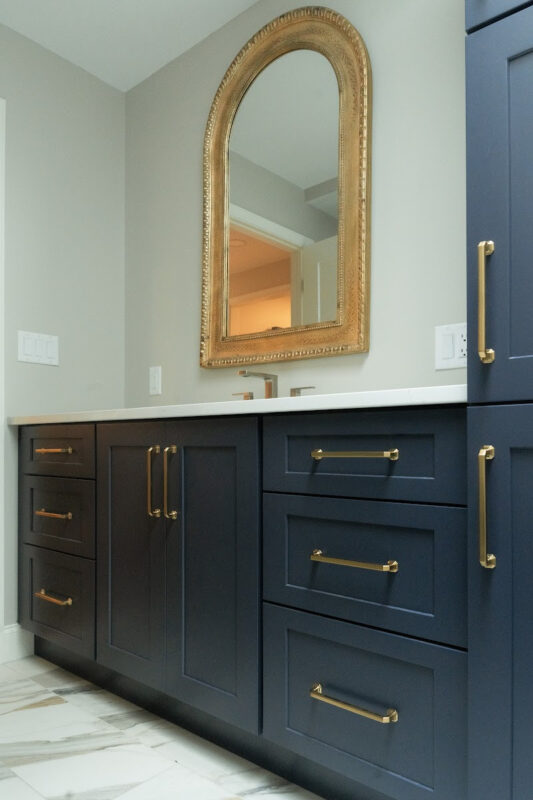 Dark Blue bathroom vanity and linen cabinets.