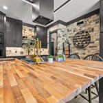 Kitchen cabinets with dark Midnight stain on Rustic Alder.