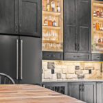 Kitchen cabinets with dark Midnight stain on Rustic Alder.