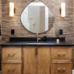 Bathroom with warm, organic tones, including a brown-stained vanity cabinet.