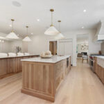 White and light brown kitchen cabinets.