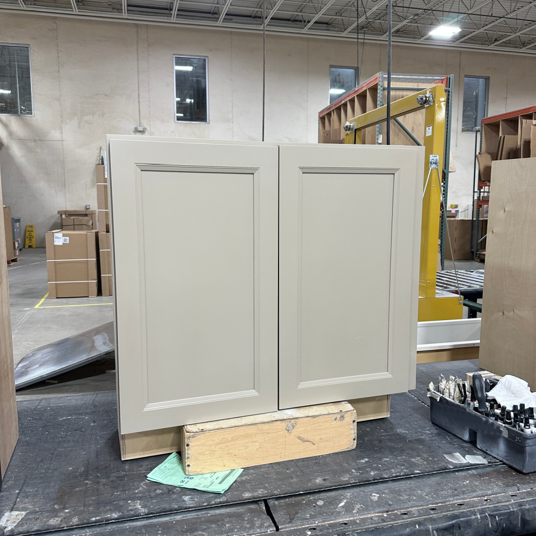 Light brown painted wall base cabinet