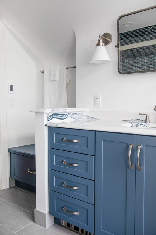 Bathroom with blue cabinetry